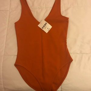 BRAND NEW Orange Bodysuit